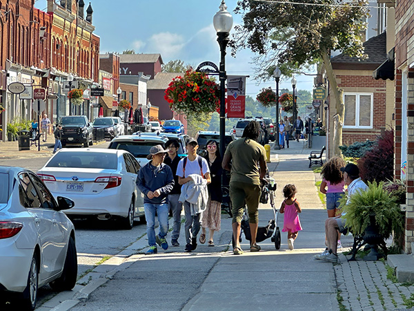 Family walking on main street of historic north american town